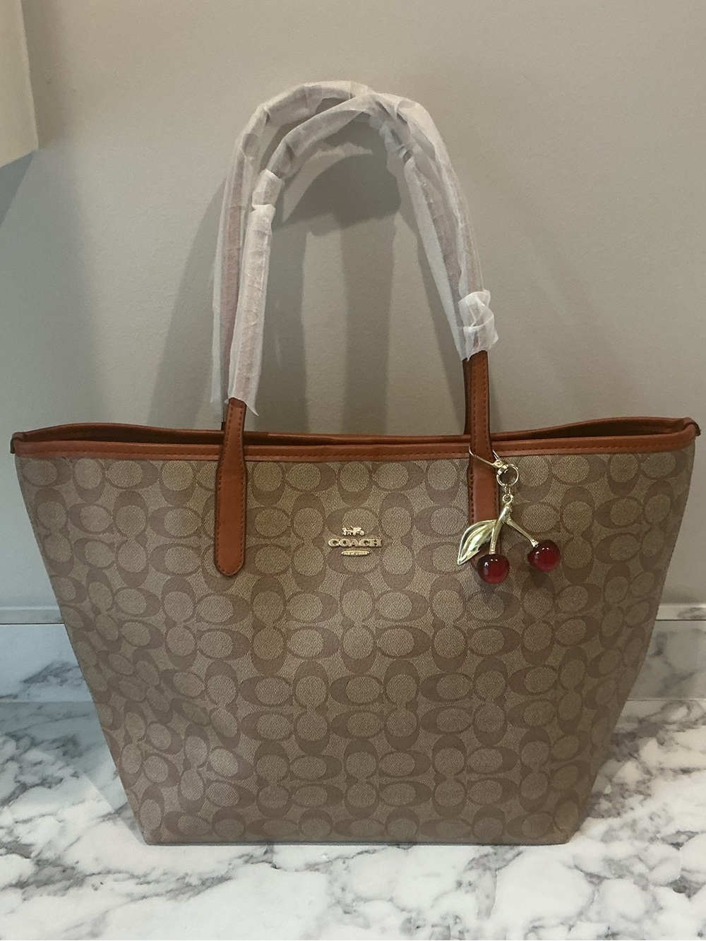 Coach Khaki Signature Canvas City Tote with Brown Trim and Cherry Charm